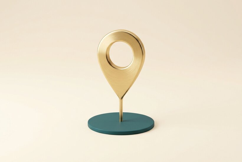 A teal sphere resting on a gold home base.